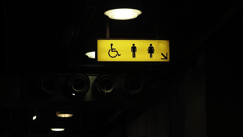 illuminated ADA restroom sign